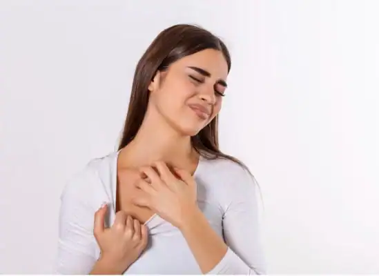 female scratching her neck because of itching