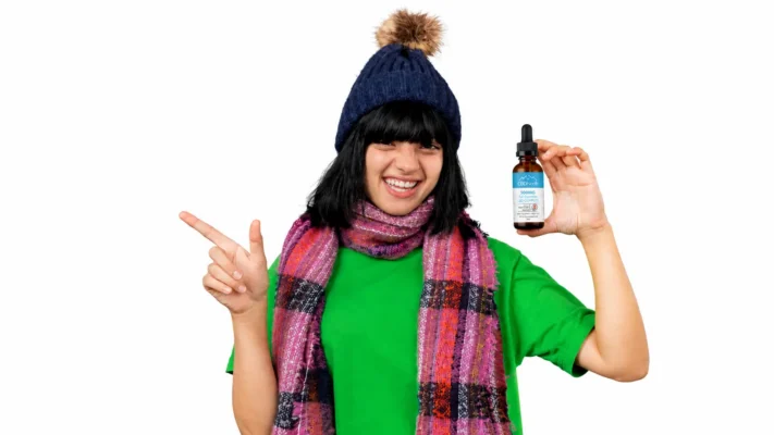 a female showing cbd north cbd oil product